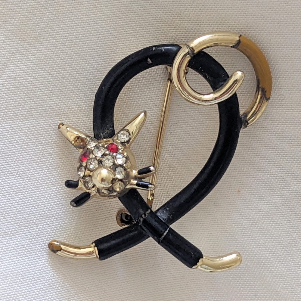 Metal Black and Gold Cat brooche with a jeweled head.
